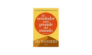 Portada del libro "El vendedor más grande del mundo" de Og Mandino. Un diseño minimalista con un círculo naranja sobre fondo amarillo y dunas de arena.