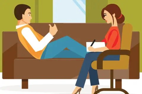 Un hombre habla con una psicóloga que toma notas. La escena ilustra la transferencia en psicología, un proceso clave en la terapia.