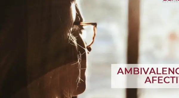 Silueta de mujer con gafas, mirando hacia la luz. El texto "AMBIVALENCIA AFECTIVA" sugiere un **ambivalente significado** en su reflexión.