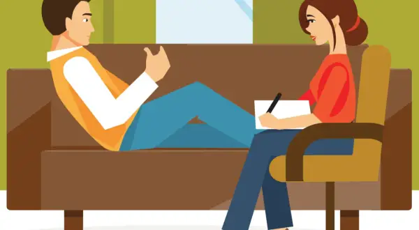 Un hombre habla con una psicóloga que toma notas. La escena ilustra la transferencia en psicología, un proceso clave en la terapia.