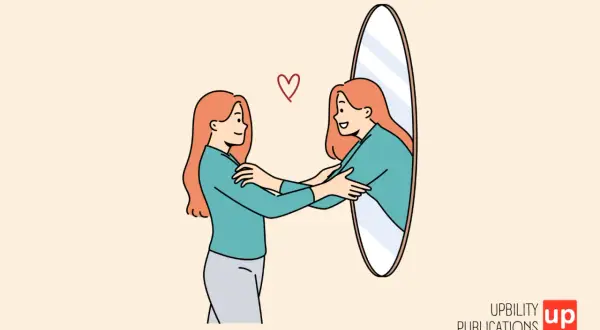 Una mujer se abraza a sí misma frente a un espejo, reflejando el verdadero autoestima significado. Un corazón rojo simboliza el amor propio.