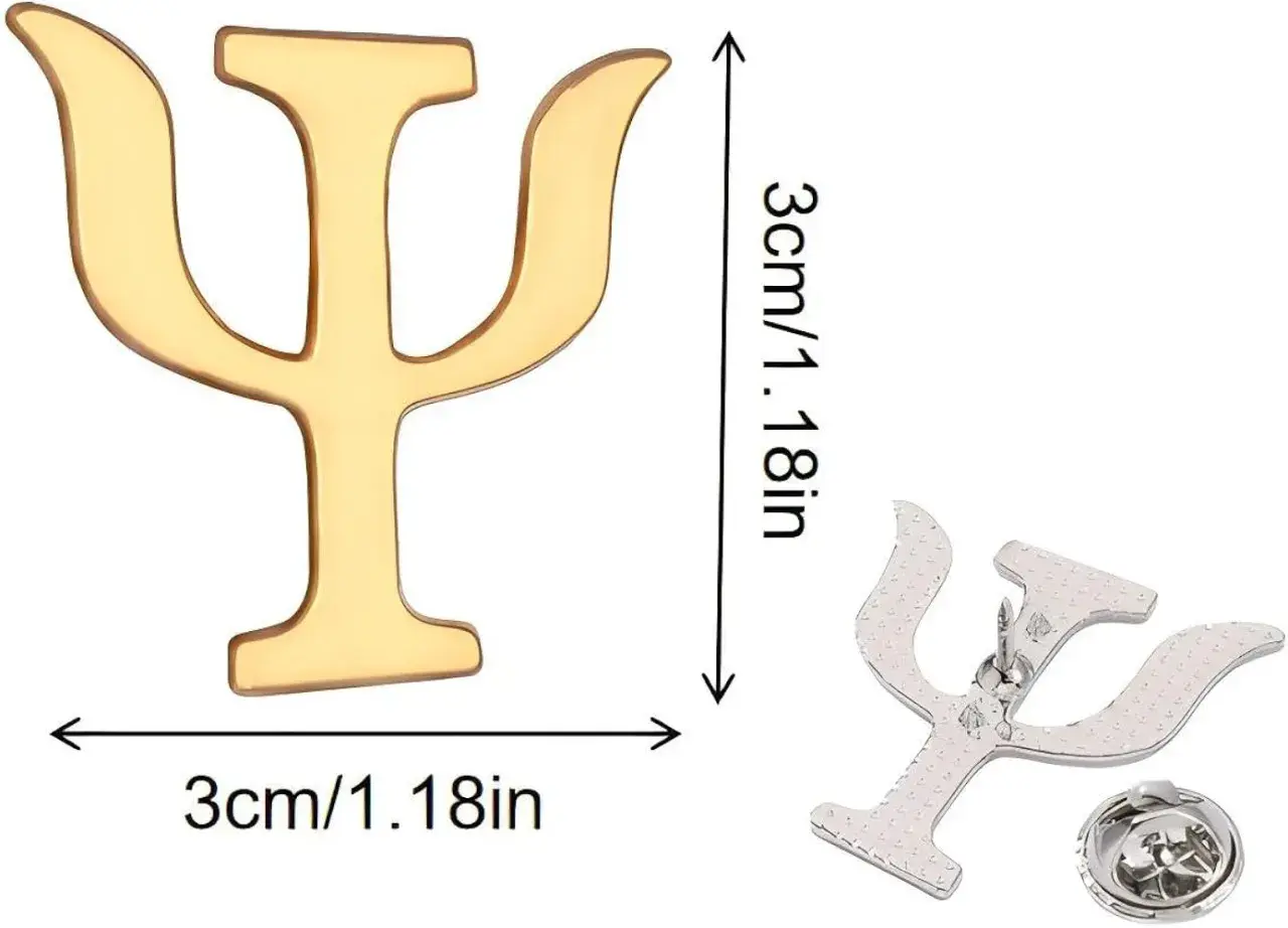 Un pin dorado con el símbolo de psicología, Psi (Ψ), de 3cm. A su lado, otro pin plateado con el mismo símbolo y su broche.