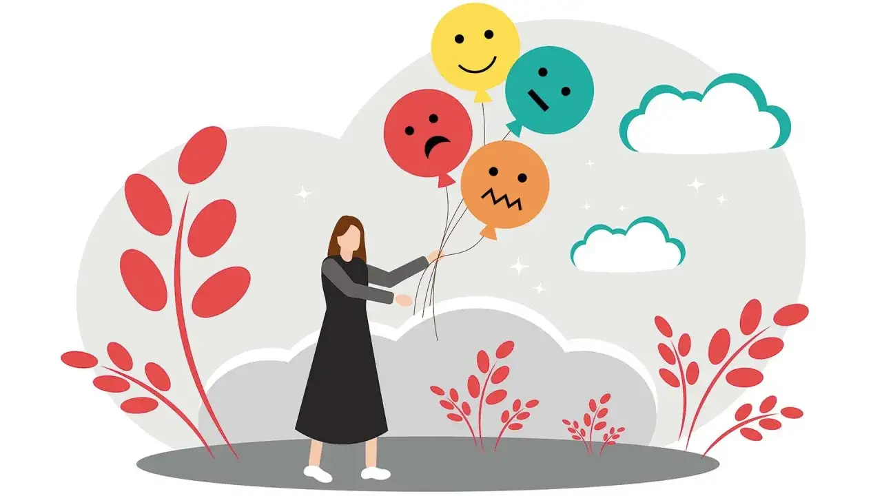 Mujer con globos de diferentes emociones, reflejo de la labilidad emocional.